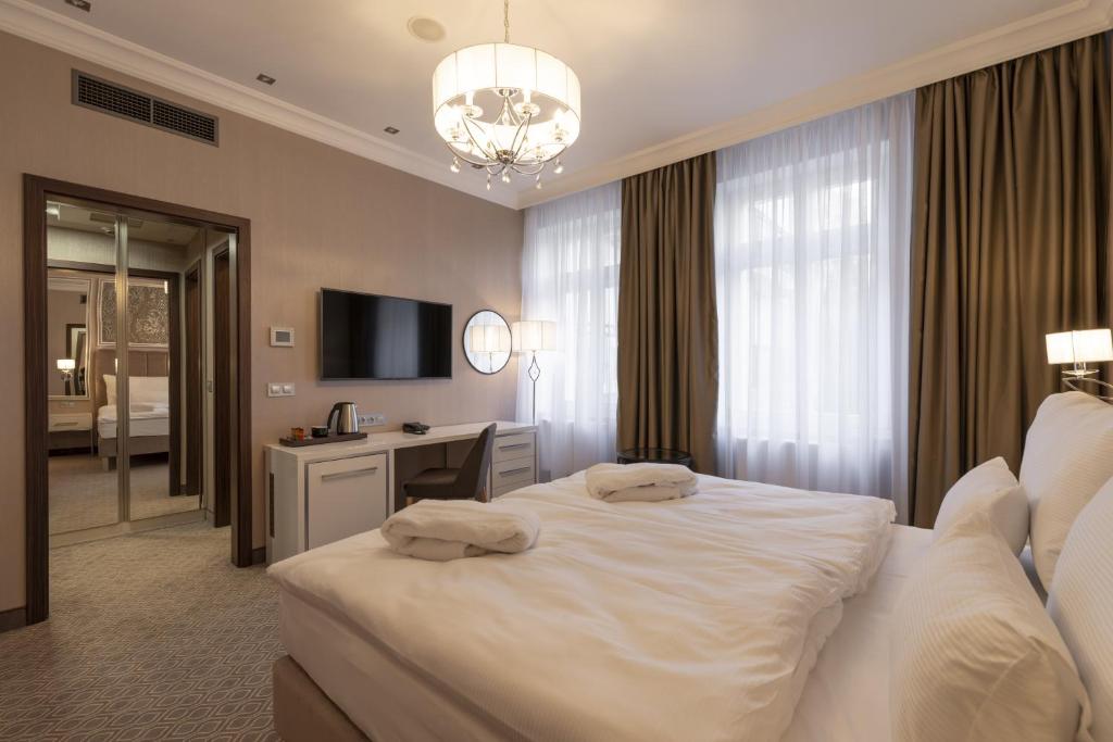 Postel nebo postele na pokoji v ubytování Spa Hotel ULRIKA