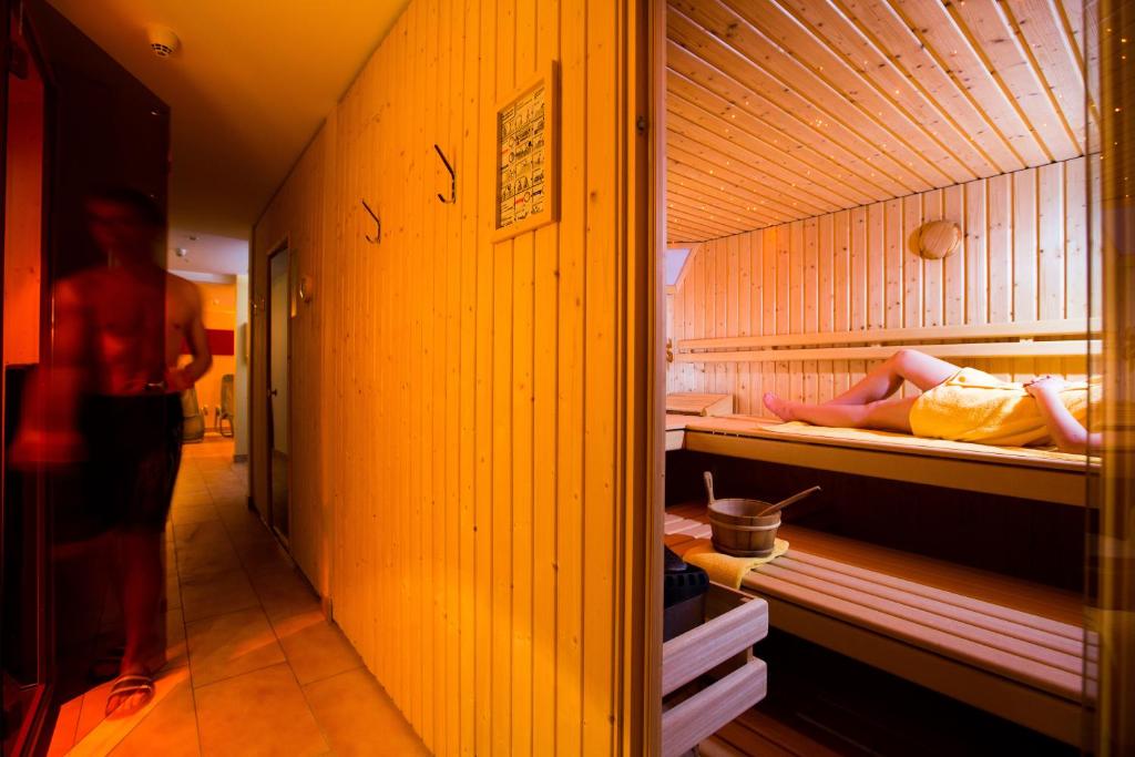 Postel nebo postele na pokoji v ubytování Hotel Cristal Flumserberg