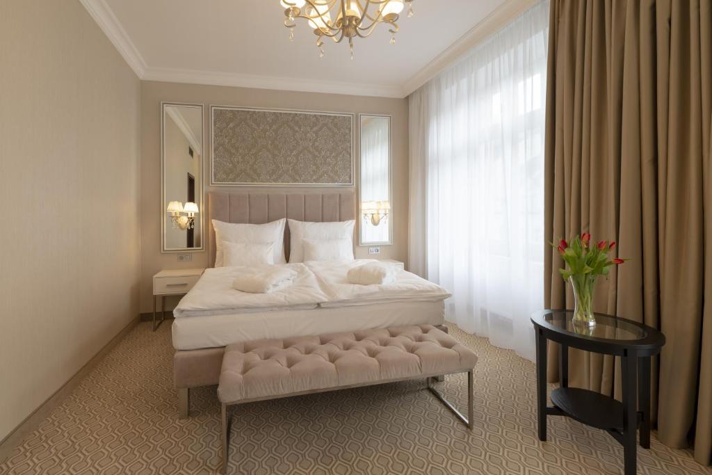 Postel nebo postele na pokoji v ubytování Spa Hotel ULRIKA