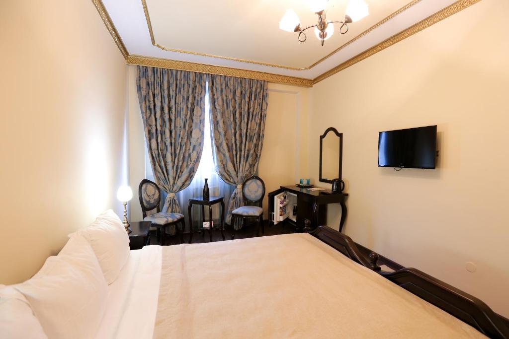TV a/nebo společenská místnost v ubytování Hotel Kreta
