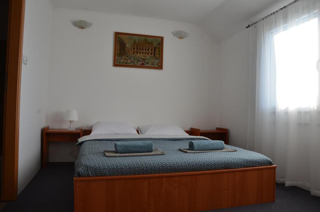 Postel nebo postele na pokoji v ubytování Enka apartmani