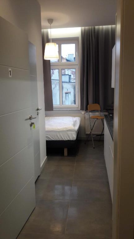 Posteľ alebo postele v izbe v ubytovaní PRZYSTANEK KATOWICE Mariacka 26