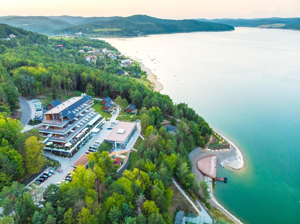 an aerial view of a resort on the shore of a lake at Hotel Zelená Lagúna in Domaša Dobrá