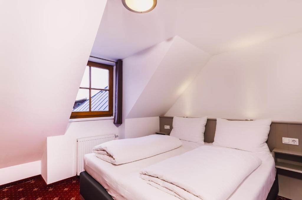Postel nebo postele na pokoji v ubytování Kitz Residenz by Alpin Rentals - incl Summercard