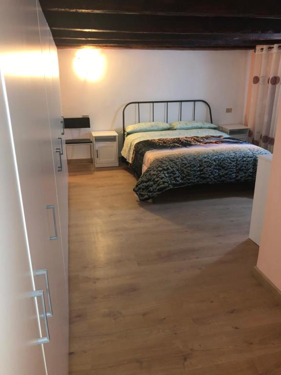 Łóżko lub łóżka w pokoju w obiekcie Locanda Beatrice