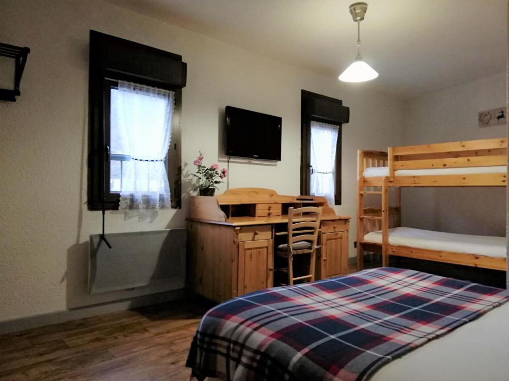 Postel nebo postele na pokoji v ubytování Terminus Hôtel des 3 Vallées