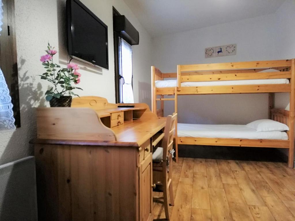 Postel nebo postele na pokoji v ubytování Terminus Hôtel des 3 Vallées