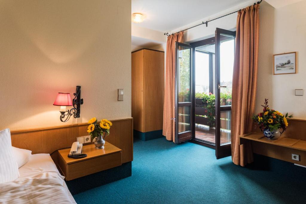 Postel nebo postele na pokoji v ubytování Hotel Stegner