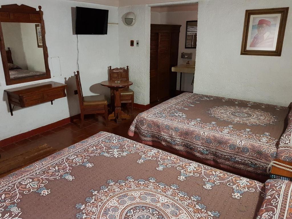 Postel nebo postele na pokoji v ubytování State Inn