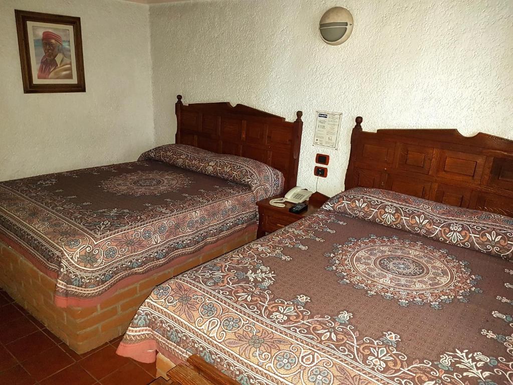 Postel nebo postele na pokoji v ubytování State Inn