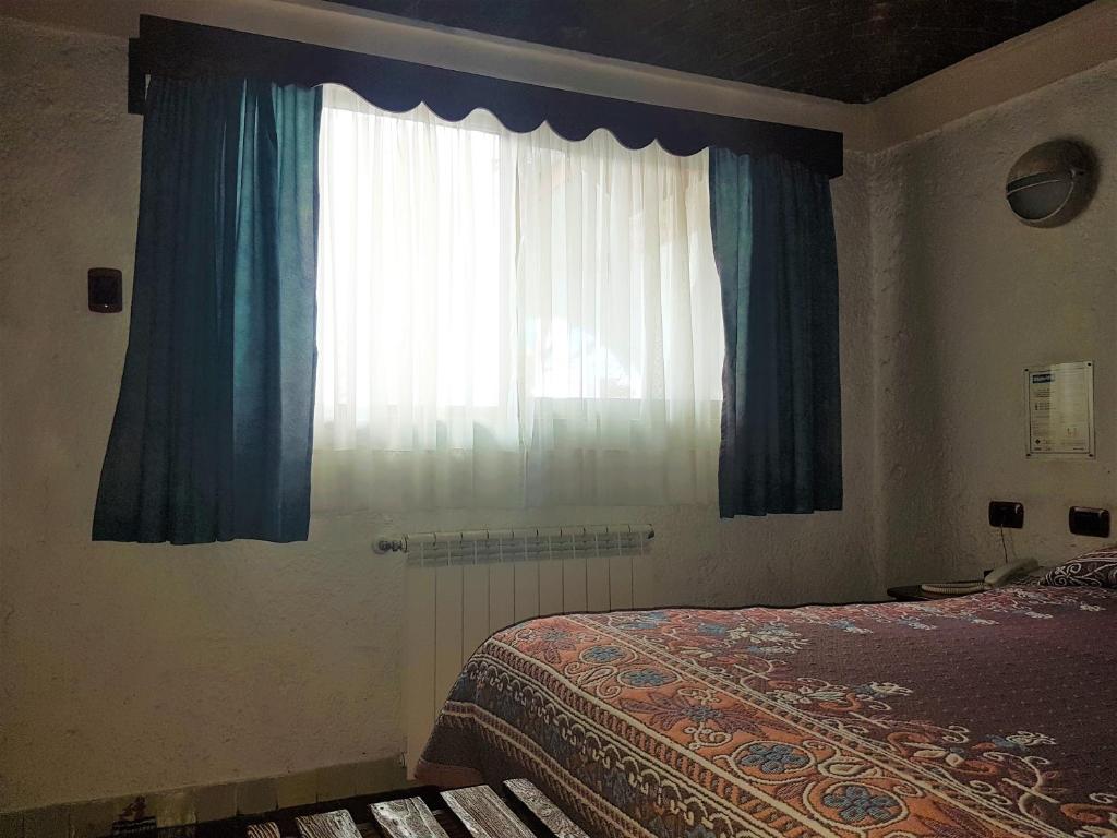 Postel nebo postele na pokoji v ubytování State Inn