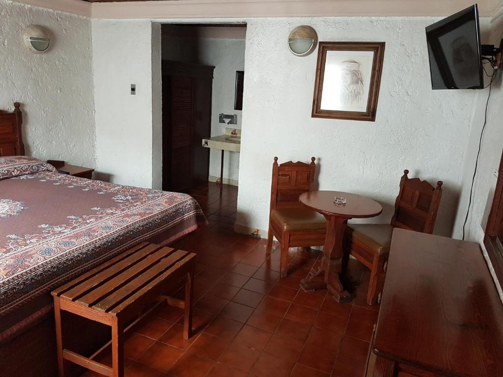 Postel nebo postele na pokoji v ubytování State Inn