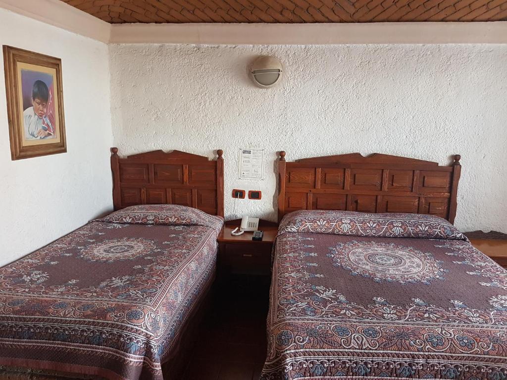 Postel nebo postele na pokoji v ubytování State Inn