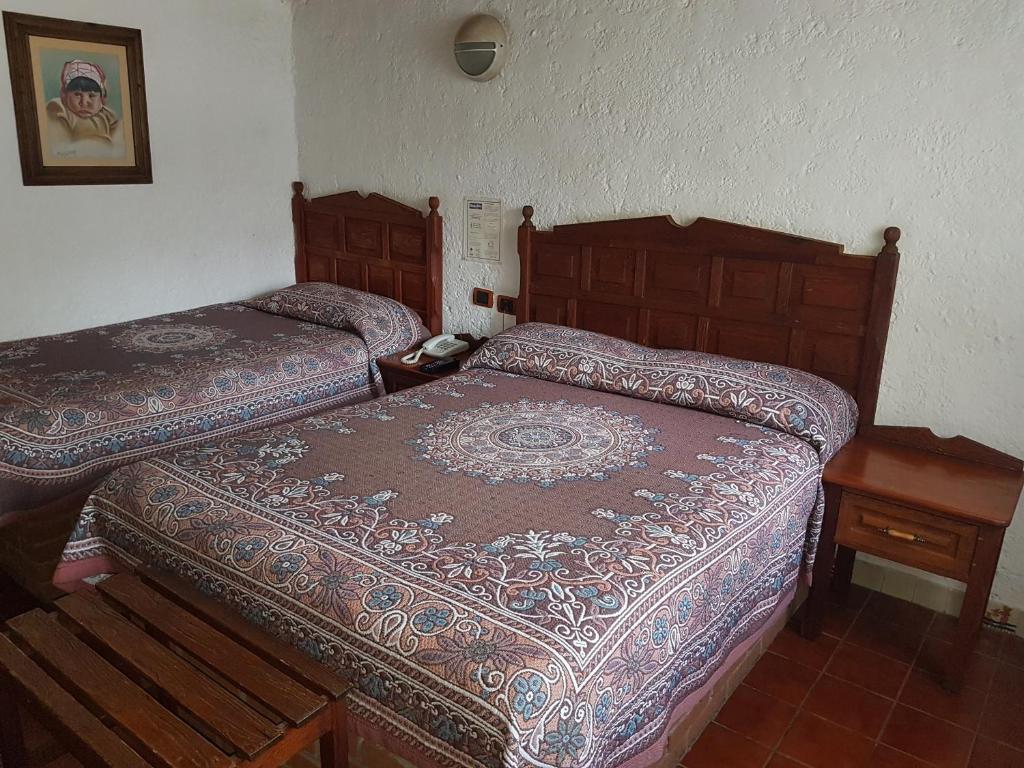 Postel nebo postele na pokoji v ubytování State Inn