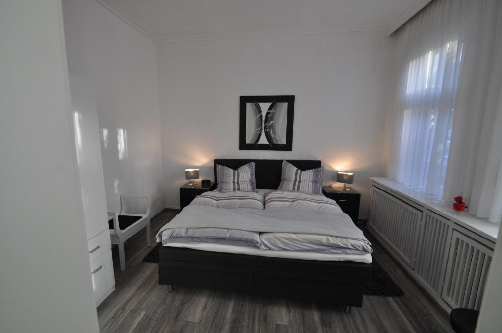Säng eller sängar i ett rum på Feriendomizil Auszeit