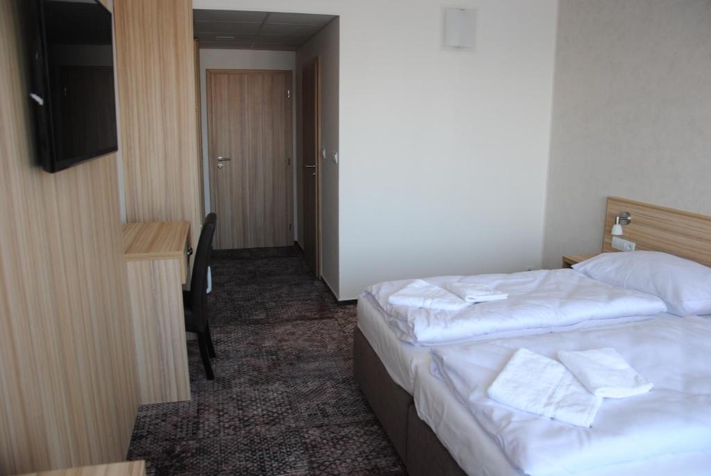 Postel nebo postele na pokoji v ubytování Hotel Labe
