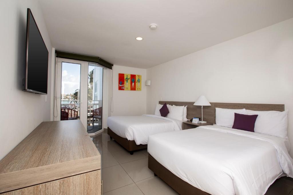 Postel nebo postele na pokoji v ubytování Hotel Decameron Maryland All Inclusive