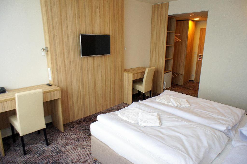 Postel nebo postele na pokoji v ubytování Hotel Labe