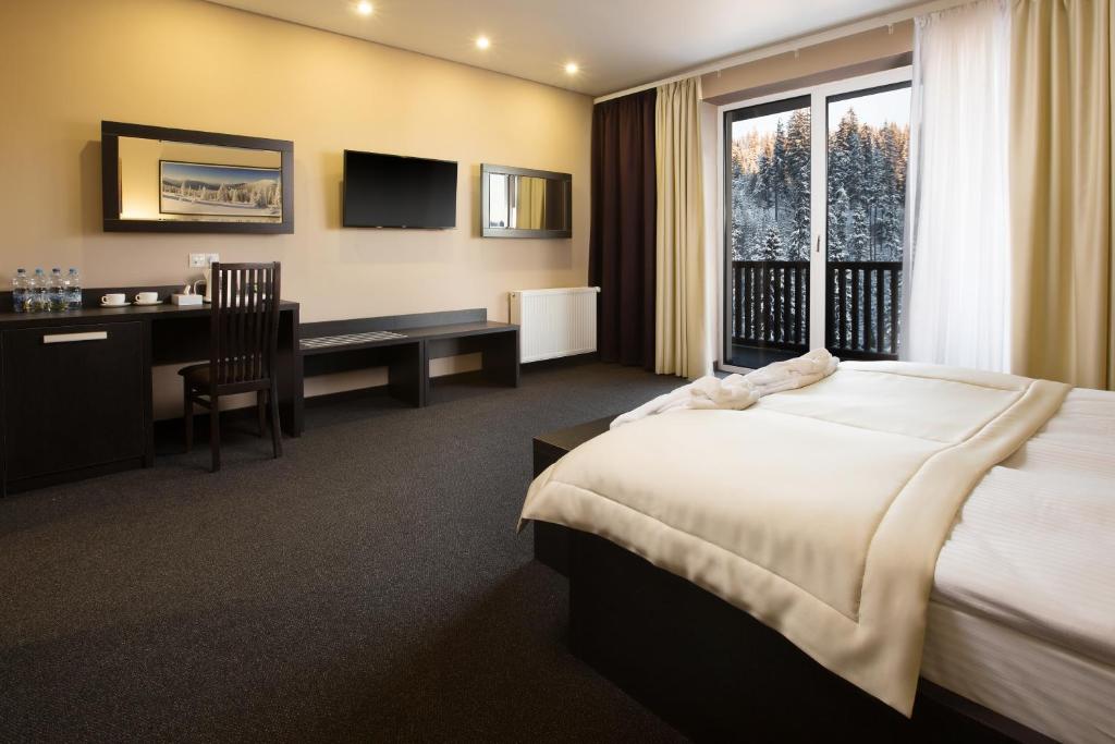 Postel nebo postele na pokoji v ubytování Girski Hotel&Spa