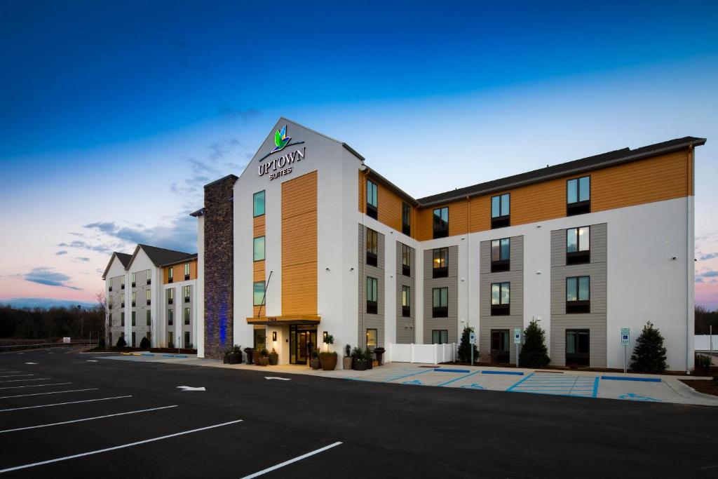 a rendering of a hotel with a parking lot at Uptown Suites Extended Stay Denver CO - Centennial in Centennial