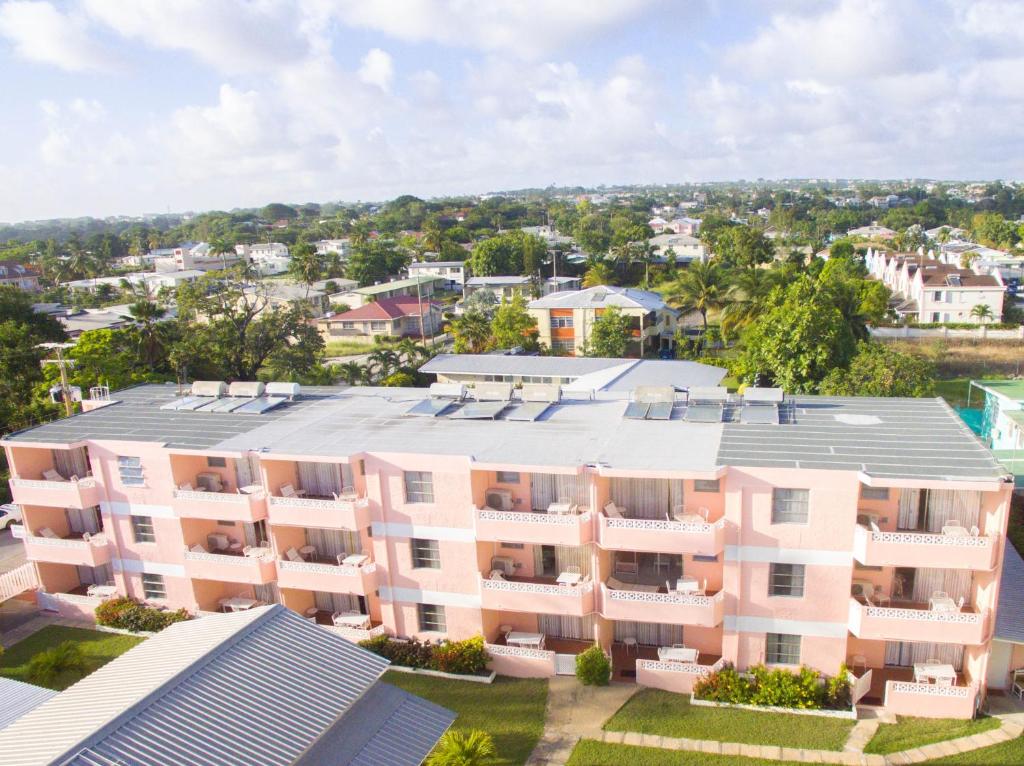 an aerial view of a pink apartment building at The Monteray Hotel in Christ Church
