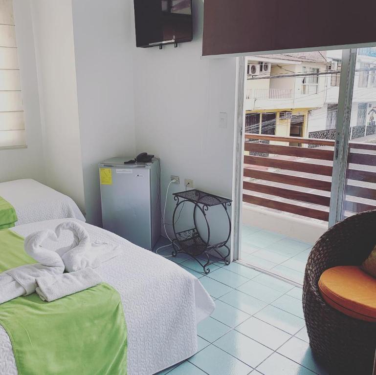 Postel nebo postele na pokoji v ubytování Hostal Costa del Pacifico