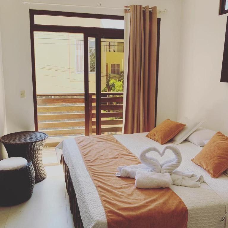 Postel nebo postele na pokoji v ubytování Hostal Costa del Pacifico