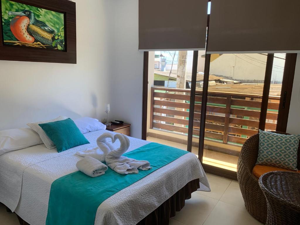 Postel nebo postele na pokoji v ubytování Hostal Costa del Pacifico