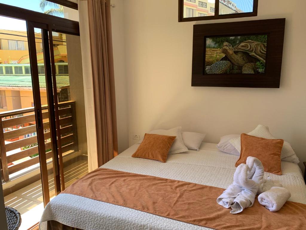 Postel nebo postele na pokoji v ubytování Hostal Costa del Pacifico