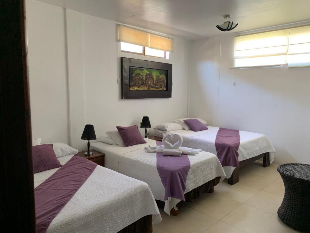 Postel nebo postele na pokoji v ubytování Hostal Costa del Pacifico