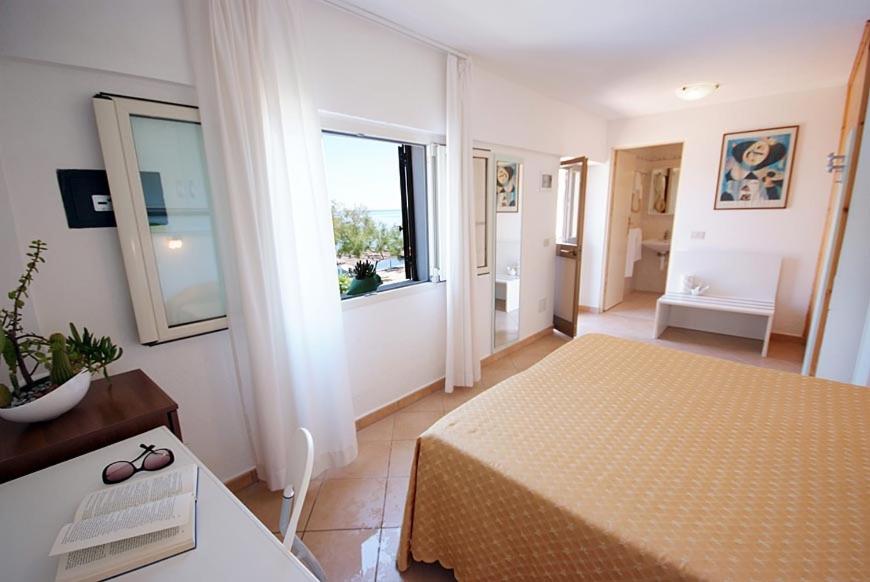 Ein Bett oder Betten in einem Zimmer der Unterkunft Hotel La Stella