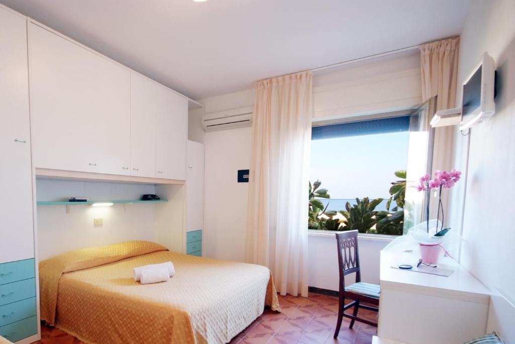 Ein Bett oder Betten in einem Zimmer der Unterkunft Hotel La Stella