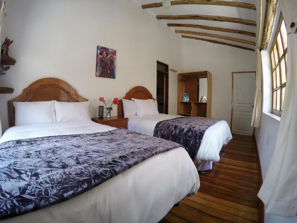 Postel nebo postele na pokoji v ubytování Parwa Guest House