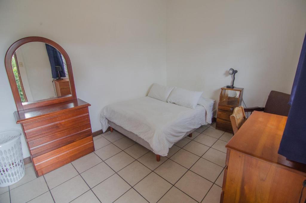 Postel nebo postele na pokoji v ubytování Casa Kibi Kibi