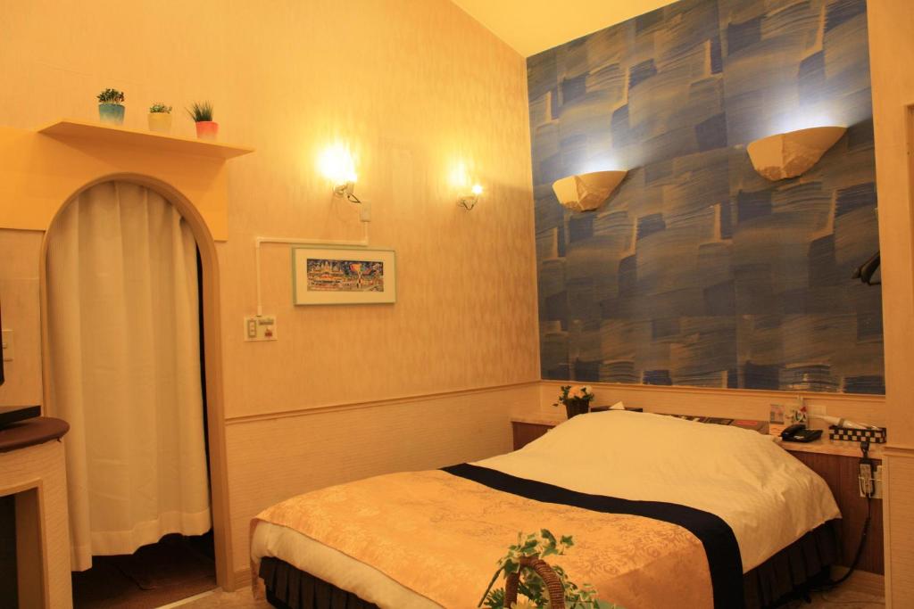 Postel nebo postele na pokoji v ubytování Restay Moon Kochi (Adult Only)