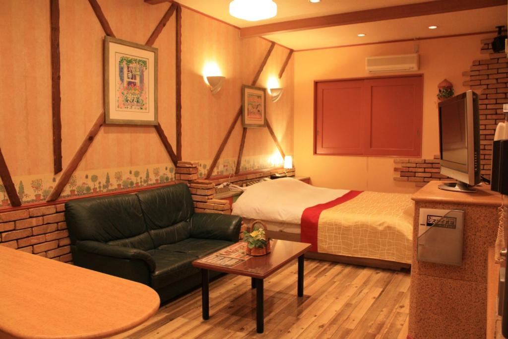 Postel nebo postele na pokoji v ubytování Restay Moon Kochi (Adult Only)