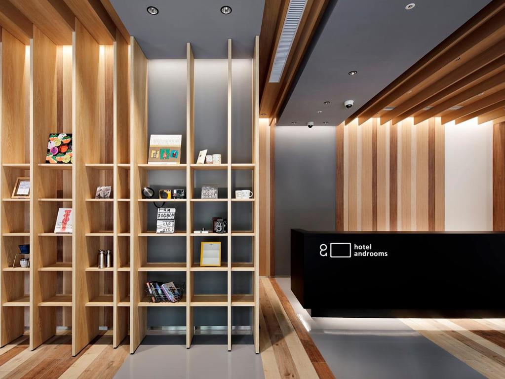 a room with wooden shelving and a book shelf at hotel androoms Nagoya Sakae in Nagoya