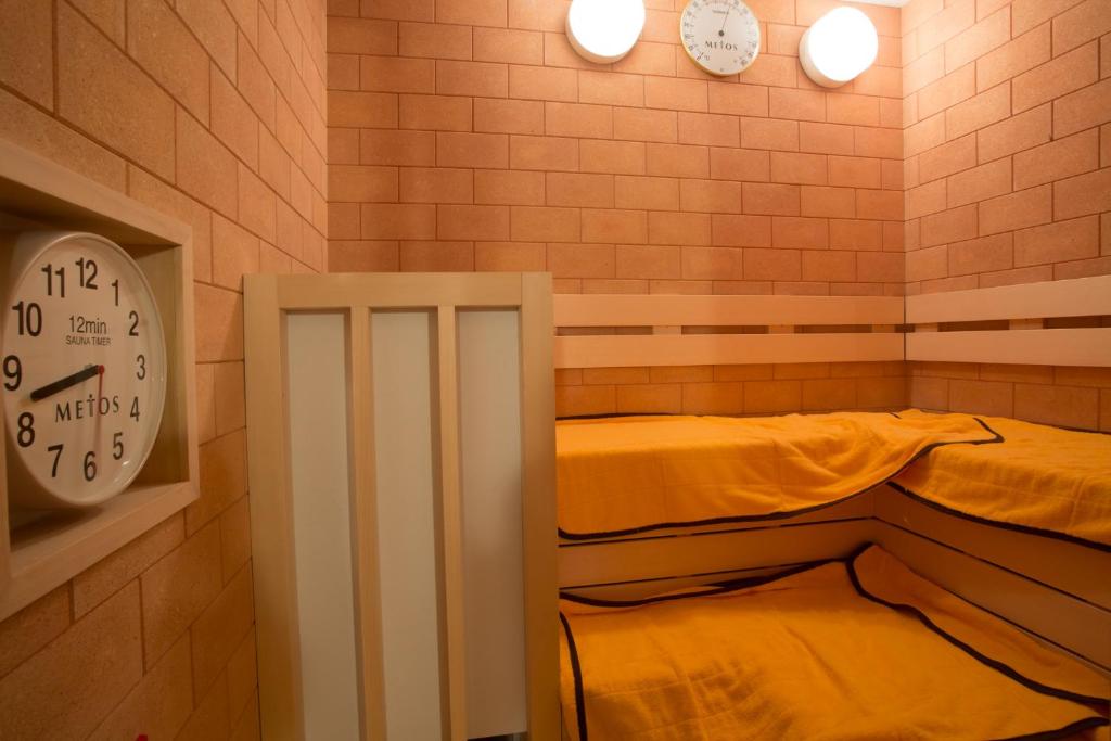 Postel nebo postele na pokoji v ubytování Kuretake-Inn Hamamatsueki Minamiguchi Premium