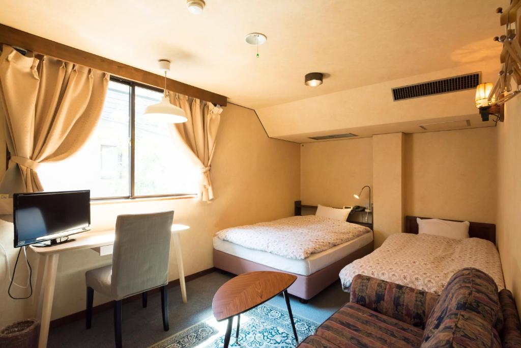 Postel nebo postele na pokoji v ubytování Hotel Haus St Anton