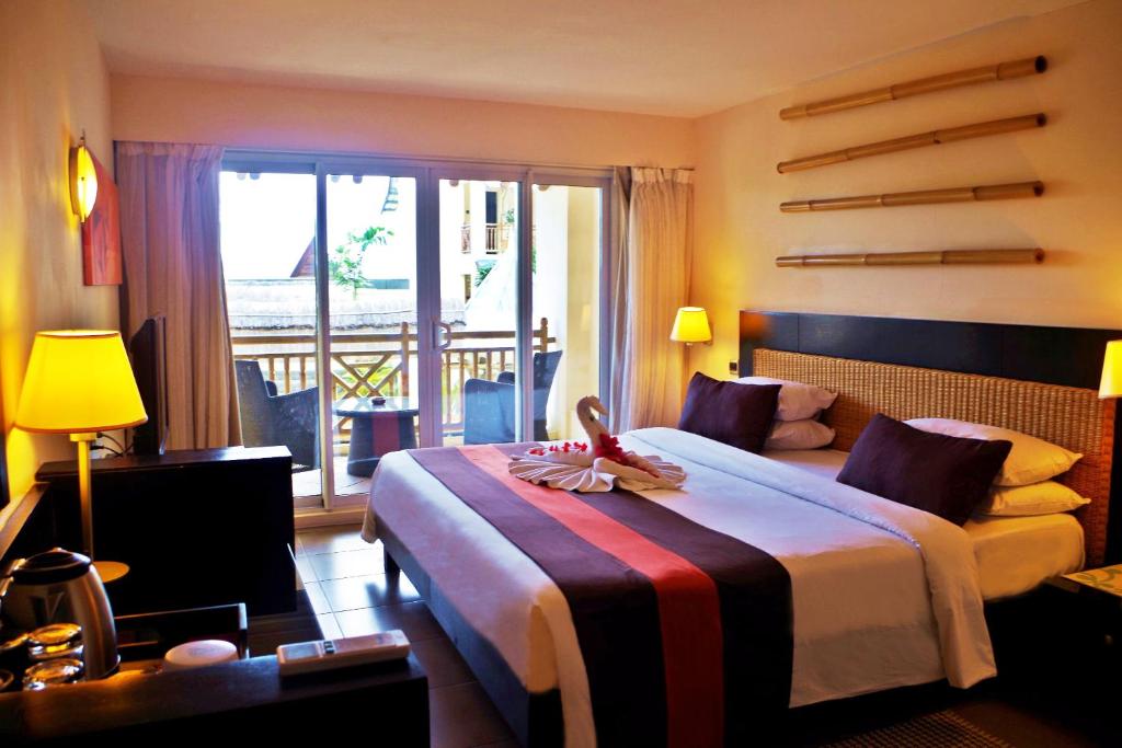 Postel nebo postele na pokoji v ubytování Pearle Beach Resort & Spa