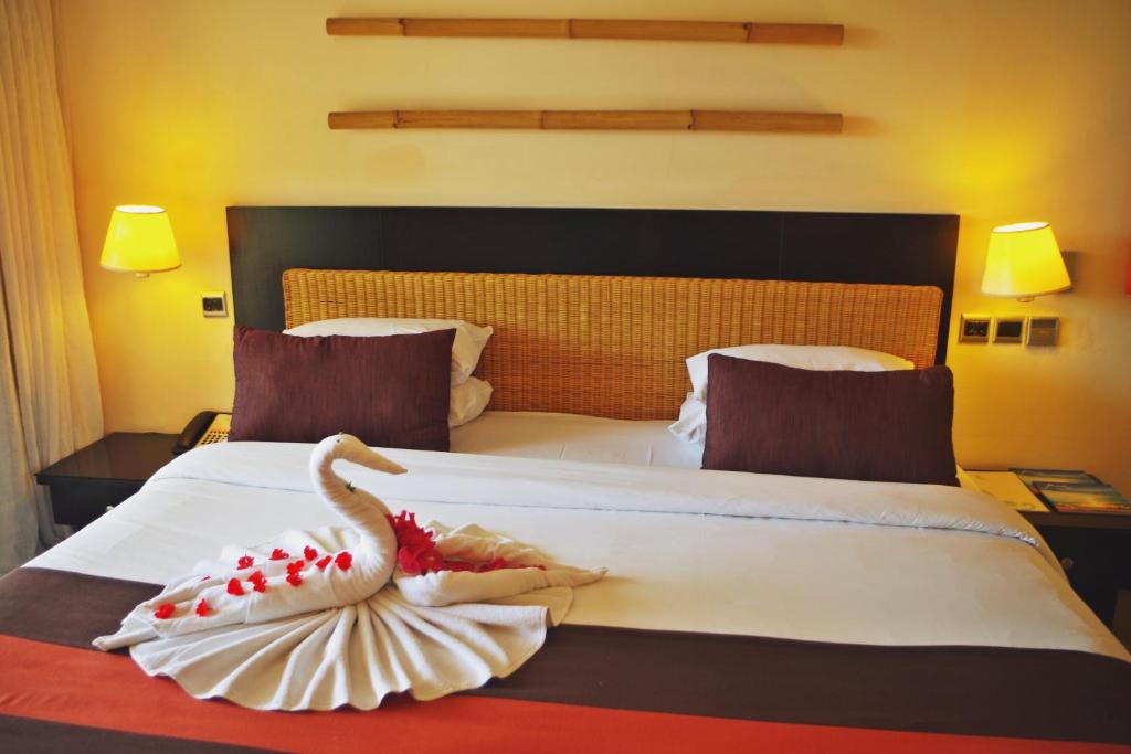 Postel nebo postele na pokoji v ubytování Pearle Beach Resort & Spa