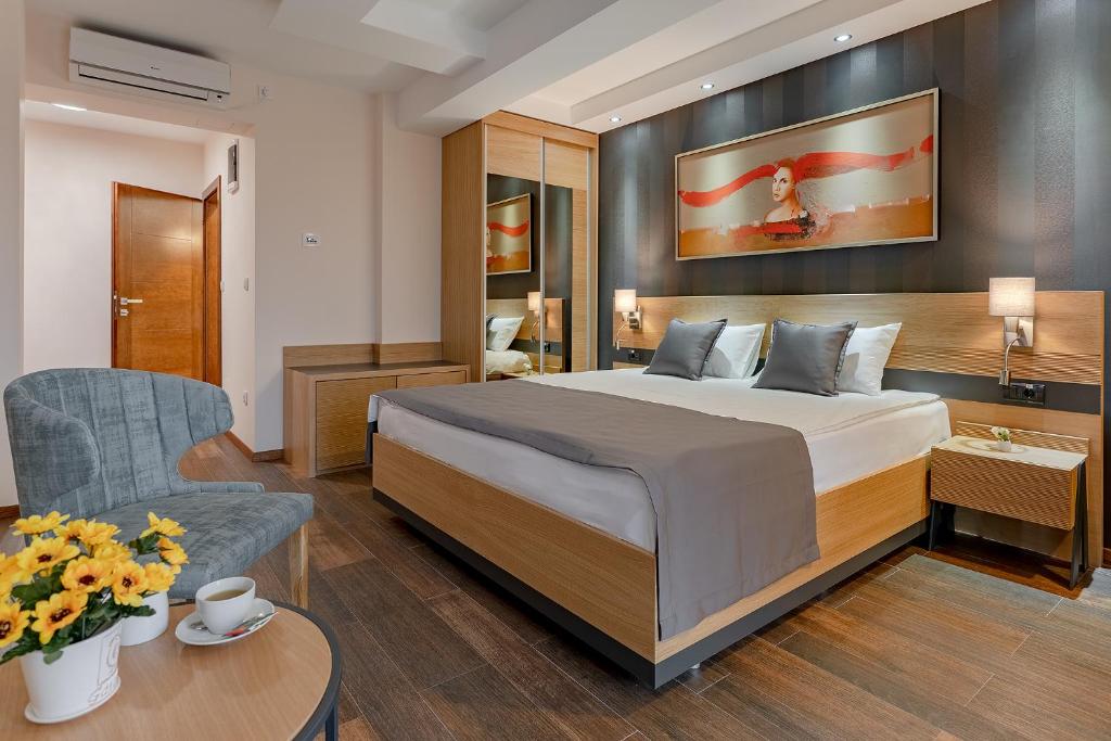 Postel nebo postele na pokoji v ubytování Rubicon Garni Hotel