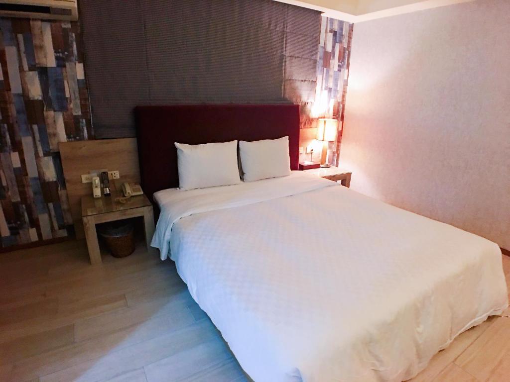 Postel nebo postele na pokoji v ubytování Love Hotel