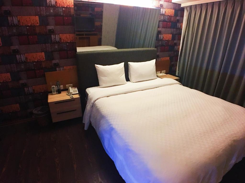 Postel nebo postele na pokoji v ubytování Love Hotel