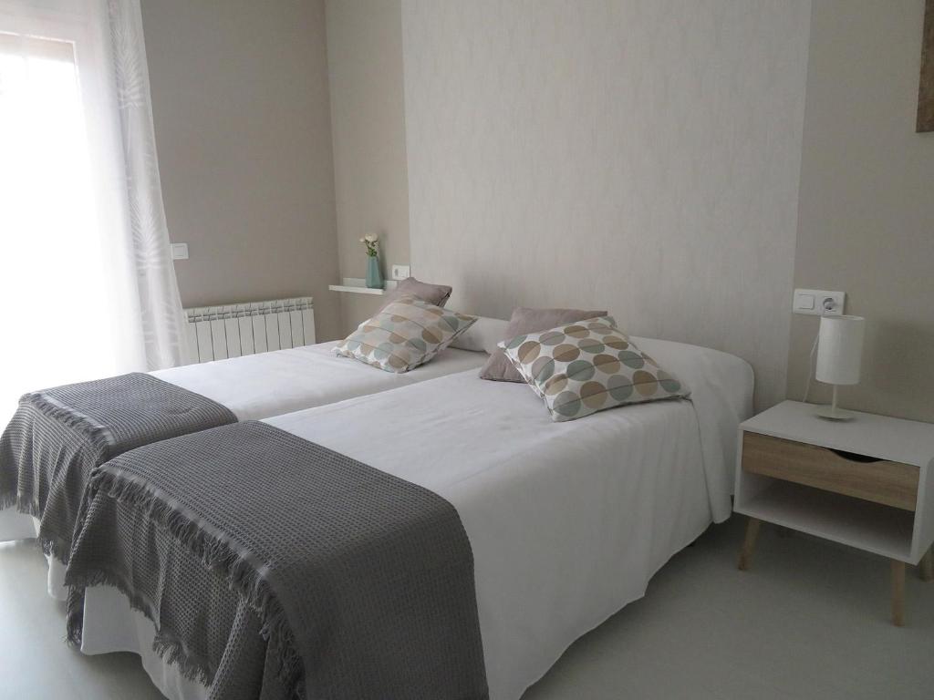 Postel nebo postele na pokoji v ubytování Alcañiz Flats II