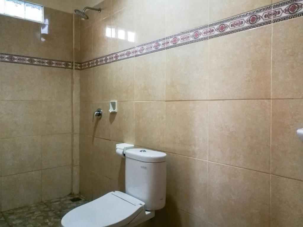 Koupelna v ubytování Mulan Dini House