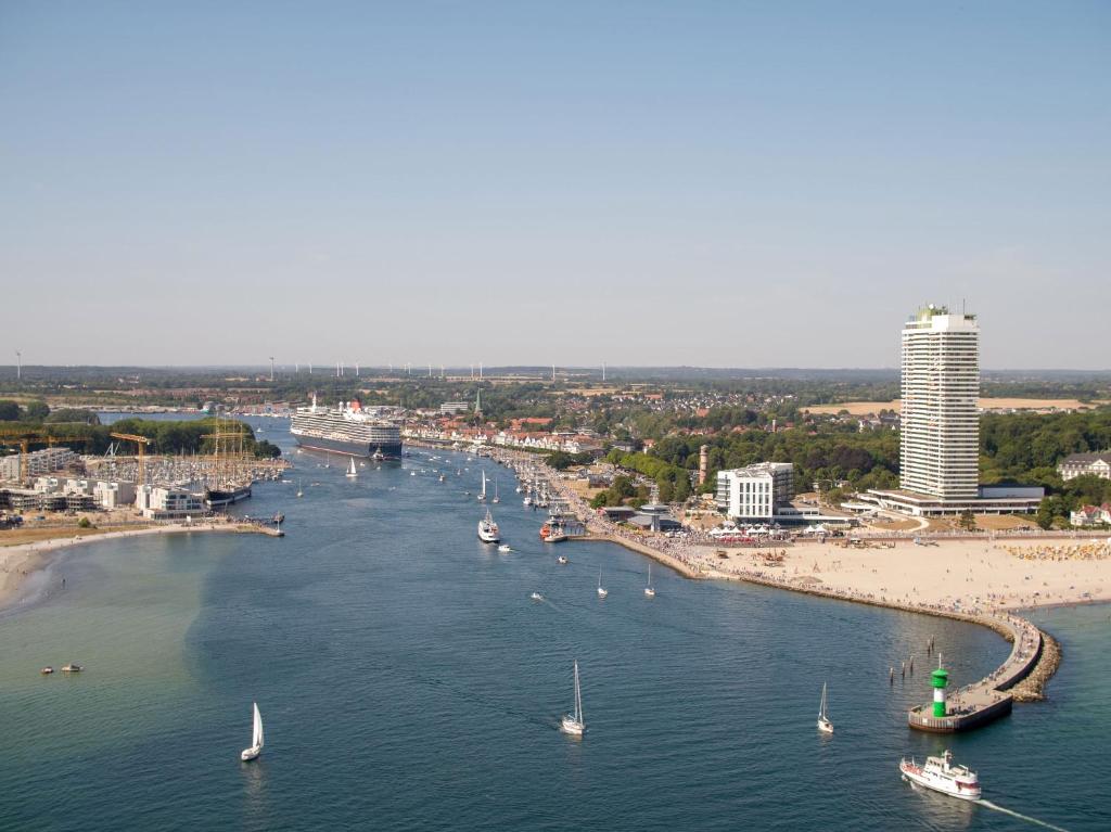 a view of a river with boats in the water at Maritim Strandhotel Travemünde in Travemünde