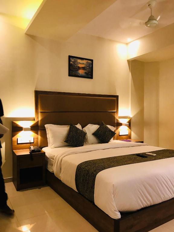 Postel nebo postele na pokoji v ubytování Hotel West Blue
