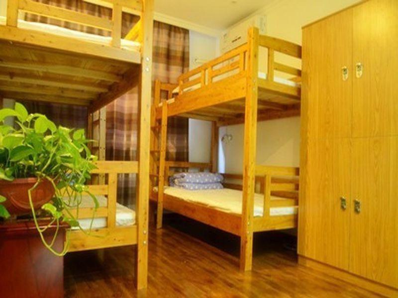Postel nebo postele na pokoji v ubytování Xi'an The Facebook Youth Hostel