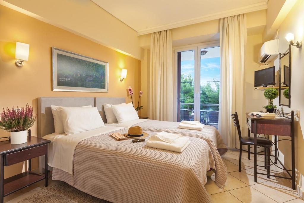 Posteľ alebo postele v izbe v ubytovaní Minavra Hotel